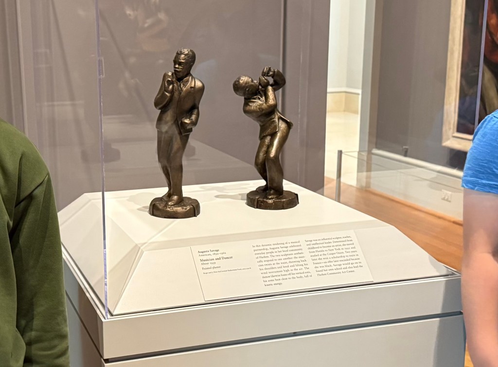 a photo of the display of Augusta Savage's sculpture called Musician and Dancer