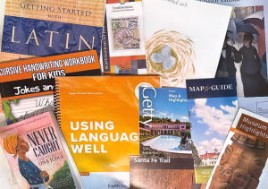 a grouping of books and museum brochures